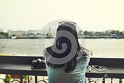 Camera Digital Device Earphones Girl River Jeans Concept Stock Photo