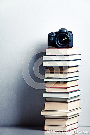 Camera on a high stack of books Stock Photo