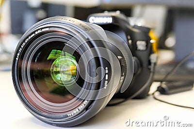 Camera lens details. Close up of a wide angle lens. Reflections in the lens. Editorial Stock Photo