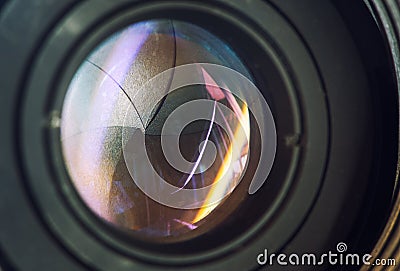 Camera lens with lens reflections modern ultra zoom photo camera front view,black DSLR camera. Stock Photo