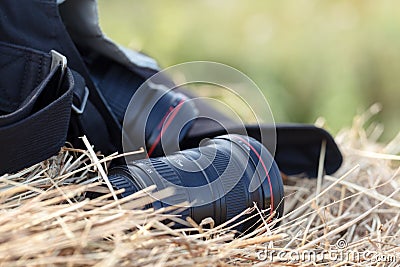 The camera is lying on a haystack, countryside protographer Stock Photo