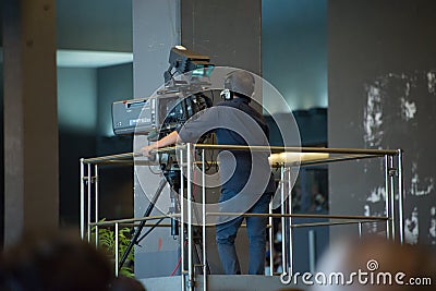 Camera man is making a video for the local news. Editorial Stock Photo