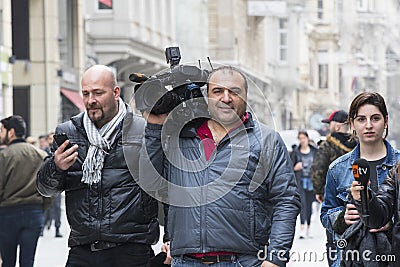 Camera operator with camera in Istiklal Street, Turkey Editorial Stock Photo