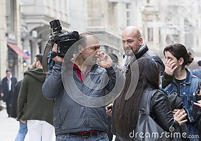 Camera operator with camera in Istiklal Street, Turkey Editorial Stock Photo