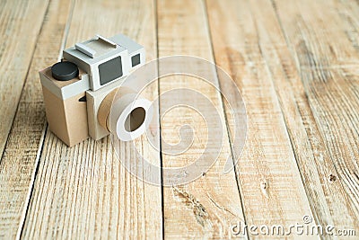Camera paper on the wood background Stock Photo