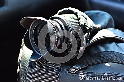 Camera lense and a photo bag Stock Photo