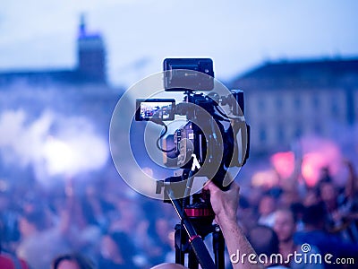 Cameraman broadcasting live tv and news from the city Stock Photo