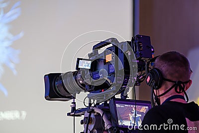 Cameraman broadcasting video at conference Editorial Stock Photo