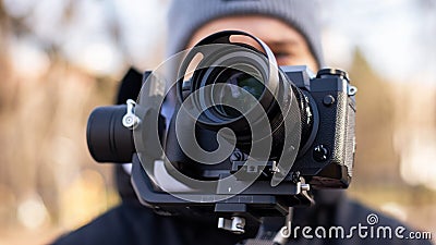 Cameraman with a camera on a steadicam Stock Photo