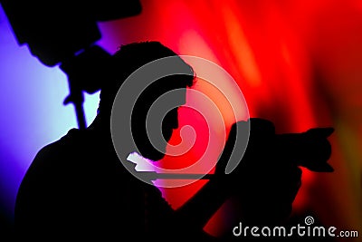 The Cameraman, Silhouette of Man with Video Camera Stock Photo