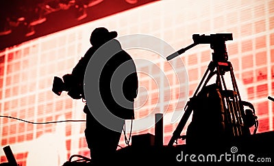 cameraman silhouette in stage lights Stock Photo