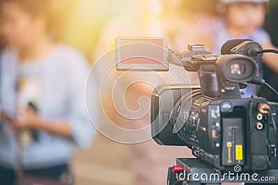Cameraman video camera field working on air interview Stock Photo