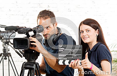 A cameraman and a woman with a movie camera Stock Photo