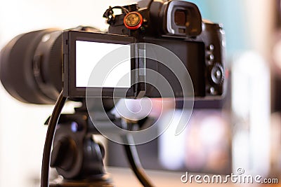 Cameraman working a movie shooting or video production with camera equipment at indoor location Stock Photo