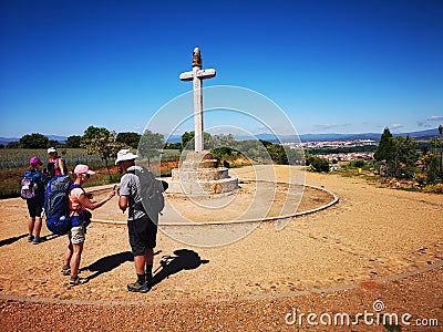 Camino de Santiago / Day 16 / Pilgrims and Concrete Cross Editorial Stock Photo