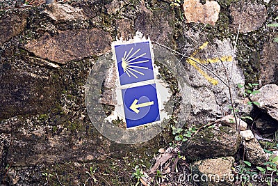 Camino de Santiago tiles on stone wall. Way of St. James signs Stock Photo