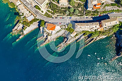 Camogli rocky coast aerial view. Boats and yachts moored near harbor with green water Stock Photo