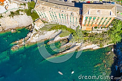 Camogli rocky coast aerial view. Boats and yachts moored near harbor with green water Stock Photo