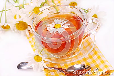 Camomile tea in glass Stock Photo