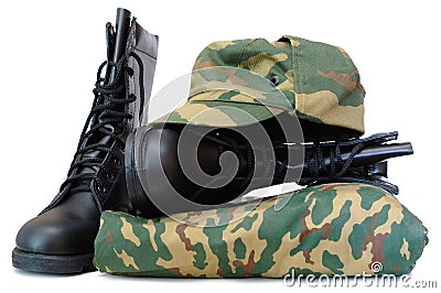 Camouflage uniform and two army boots. Stock Photo