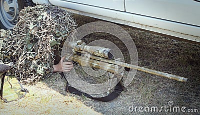 A camouflaged sniper is in the car Editorial Stock Photo