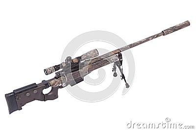 Camouflaged sniper rifle with scope Stock Photo