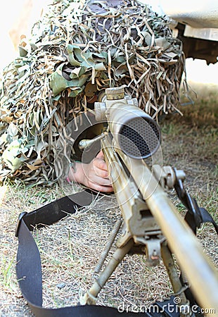 The camouflaged sniper Stock Photo