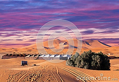 Camp site with tents over sand dunes in Sahara Desert Stock Photo