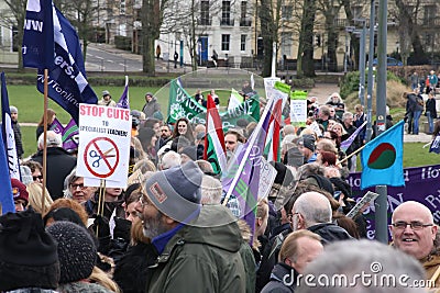 Campaigners march through Brighton, UK in protest against the planned cuts to public sector services. The march was organised by B Editorial Stock Photo