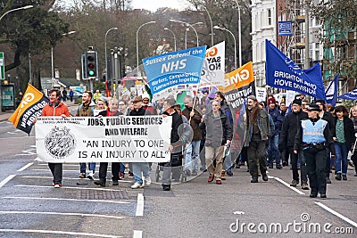 Campaigners march through Brighton, UK in protest against the planned cuts to public sector services. The march was organised by B Editorial Stock Photo