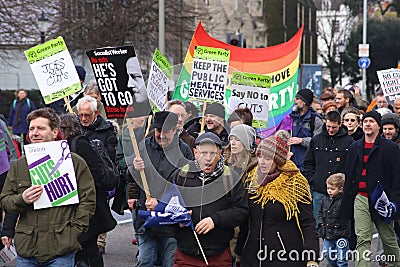 Campaigners march through Brighton, UK in protest against the planned cuts to public sector services. The march was organised by B Editorial Stock Photo