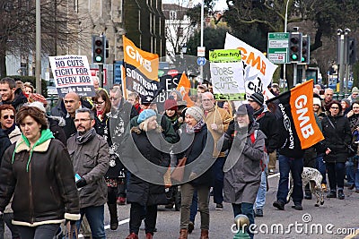 Campaigners march through Brighton, UK in protest against the planned cuts to public sector services. The march was organised by B Editorial Stock Photo