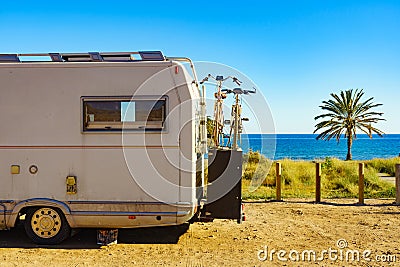 Camper with bicycles on beach, camping on sea Stock Photo