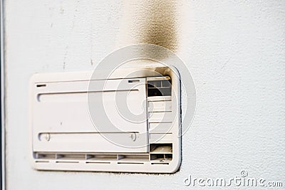 Camper car detail. Grid, ventilation plate for fridge with smoke Stock Photo