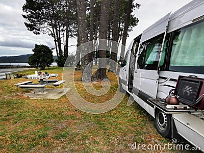 Campervan at Matarangi harbour side. Coromandel. New Zealand. Summer camping trip Stock Photo