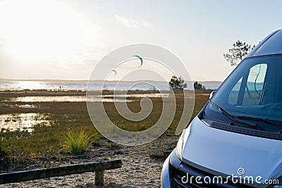Campervan parked on lake side in summer vanlife day Stock Photo