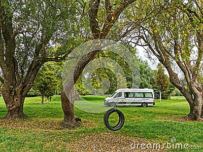 A campervan parked on a lawn in New Zealand Editorial Stock Photo