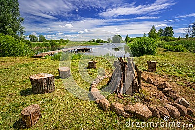 Campfire place at the lake in summer time Stock Photo