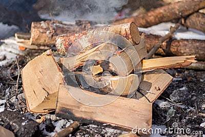 Campfire wood with smoke Stock Photo