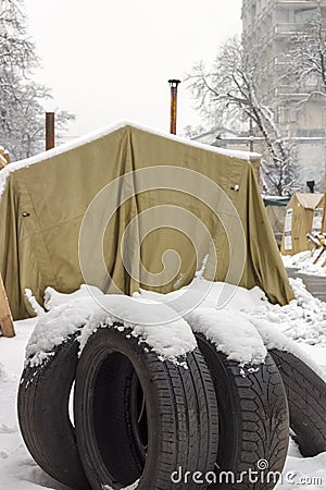 Campground protesters with wooden barricades and automotive rubber for setting fire. Editorial Stock Photo