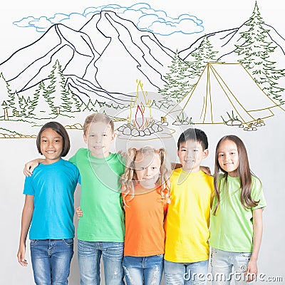 Camping and campfire summer vacation, group of children at mountain camp Stock Photo