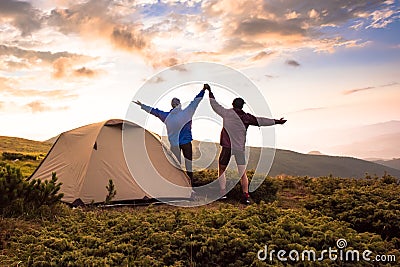 Camping and couple on the top of high mountains Stock Photo