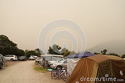 Camping ground and smoke from the bushfire Editorial Stock Photo
