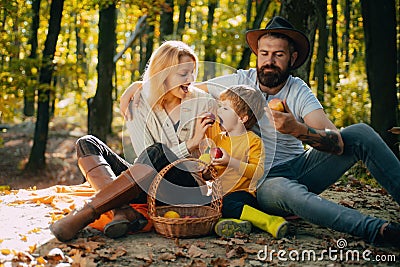 Camping with kids. Father mather and son camping. Parent teach baby. Dad mom and son playing together. Happy family Stock Photo