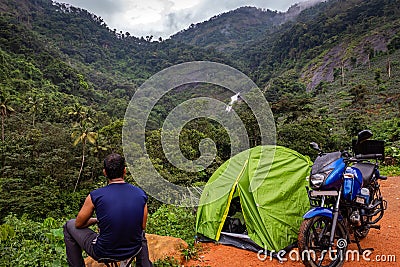 Camping solo traveller life in forest Editorial Stock Photo