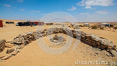 Camping tents and campfire in the middle of the Moroccan Sahara Stock Photo