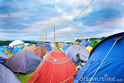 Camping, tents and outdoor music festival in park on holiday or vacation in summer. Camp, site and shelter setup at Stock Photo