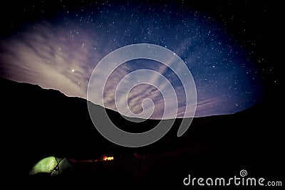 Camping under stars in mountains Stock Photo