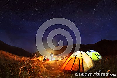 Camping under the stars at night Stock Photo