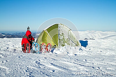 Camping during winter hiking in Carpathian mountains. Stock Photo